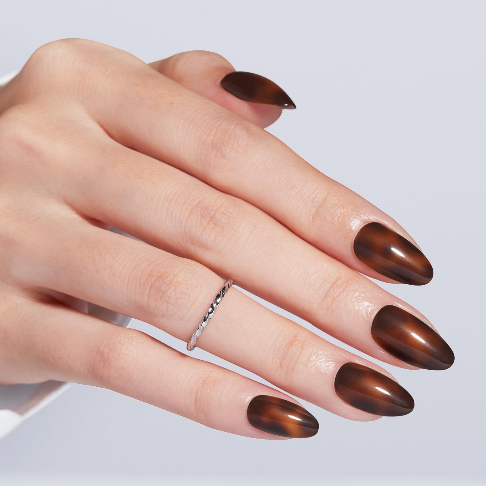 modelones close-up of nail surface texture highlighting smooth amber finish