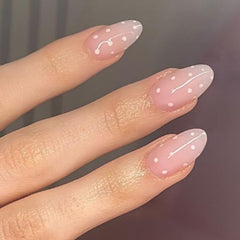 modelones close-up of polka dot almond nail texture highlighting durable smooth finish