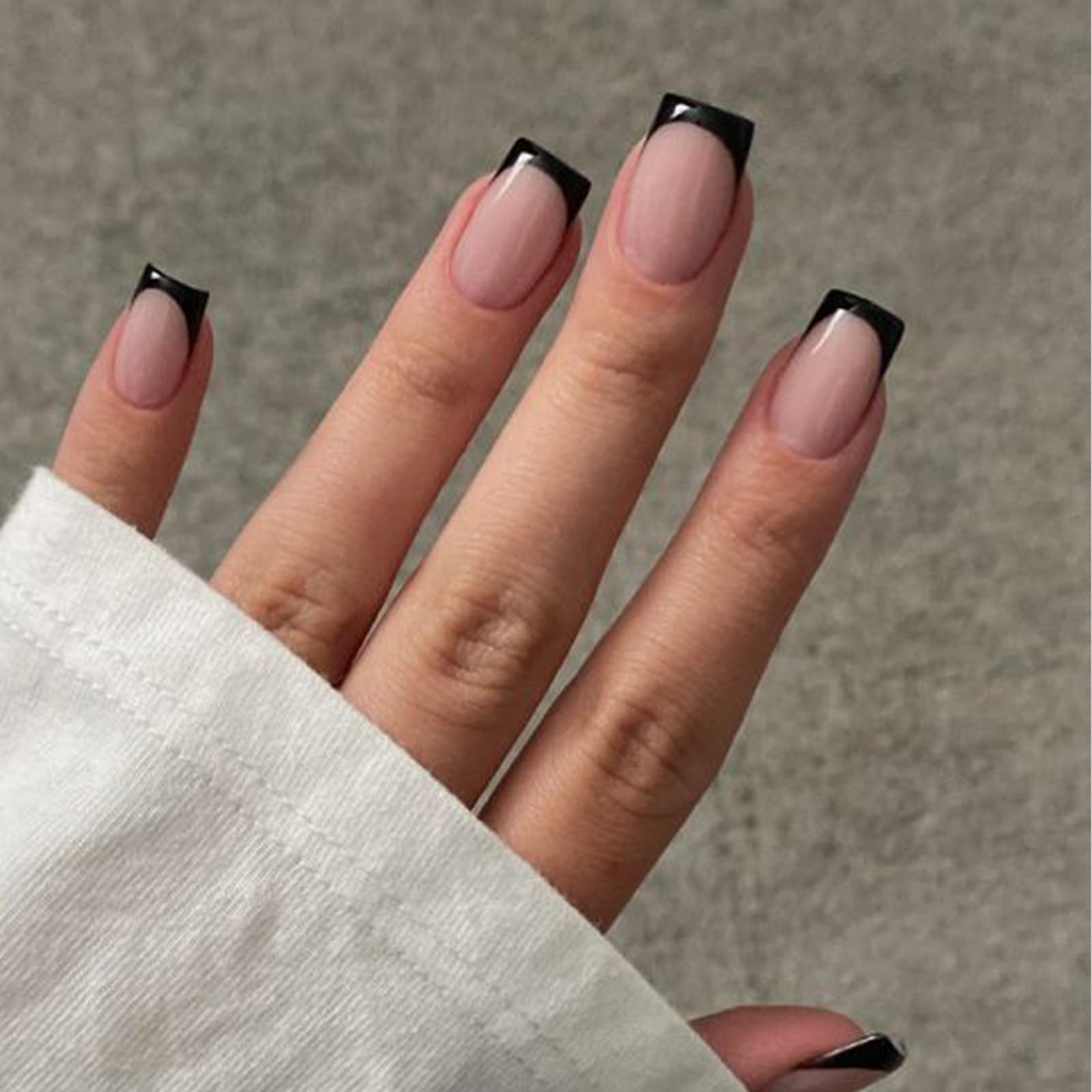 Modelones front packaging showing 32-piece black French kit for quick manicures