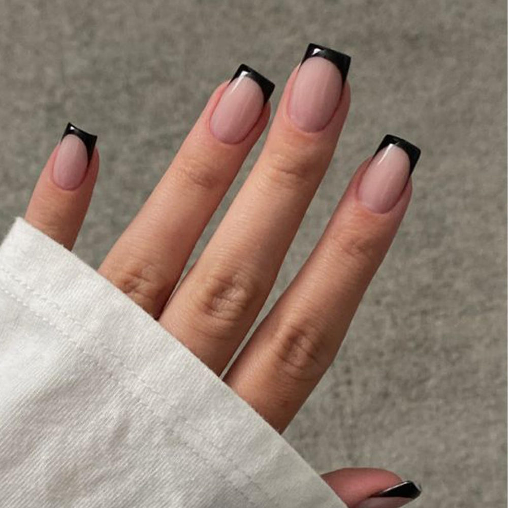 Modelones front packaging showing 32-piece black French kit for quick manicures