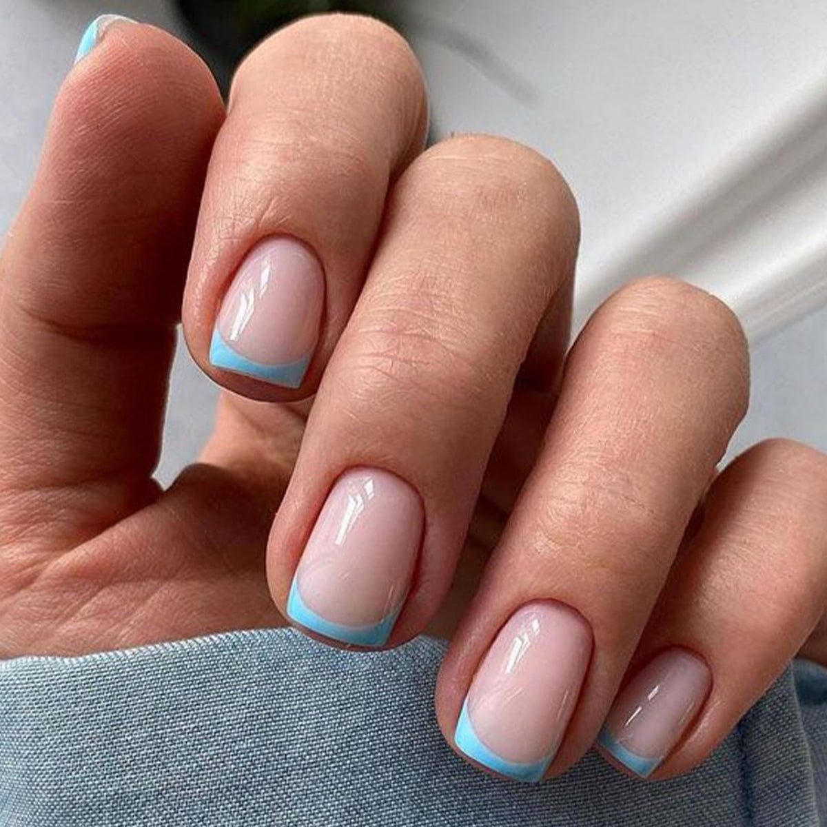 modelones front packaging showing blue French short square nails and kit components for easy styling
