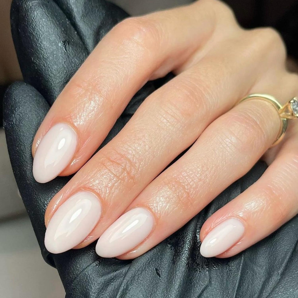 modelones front packaging showing milky white almond nails and kit contents for immediate wear