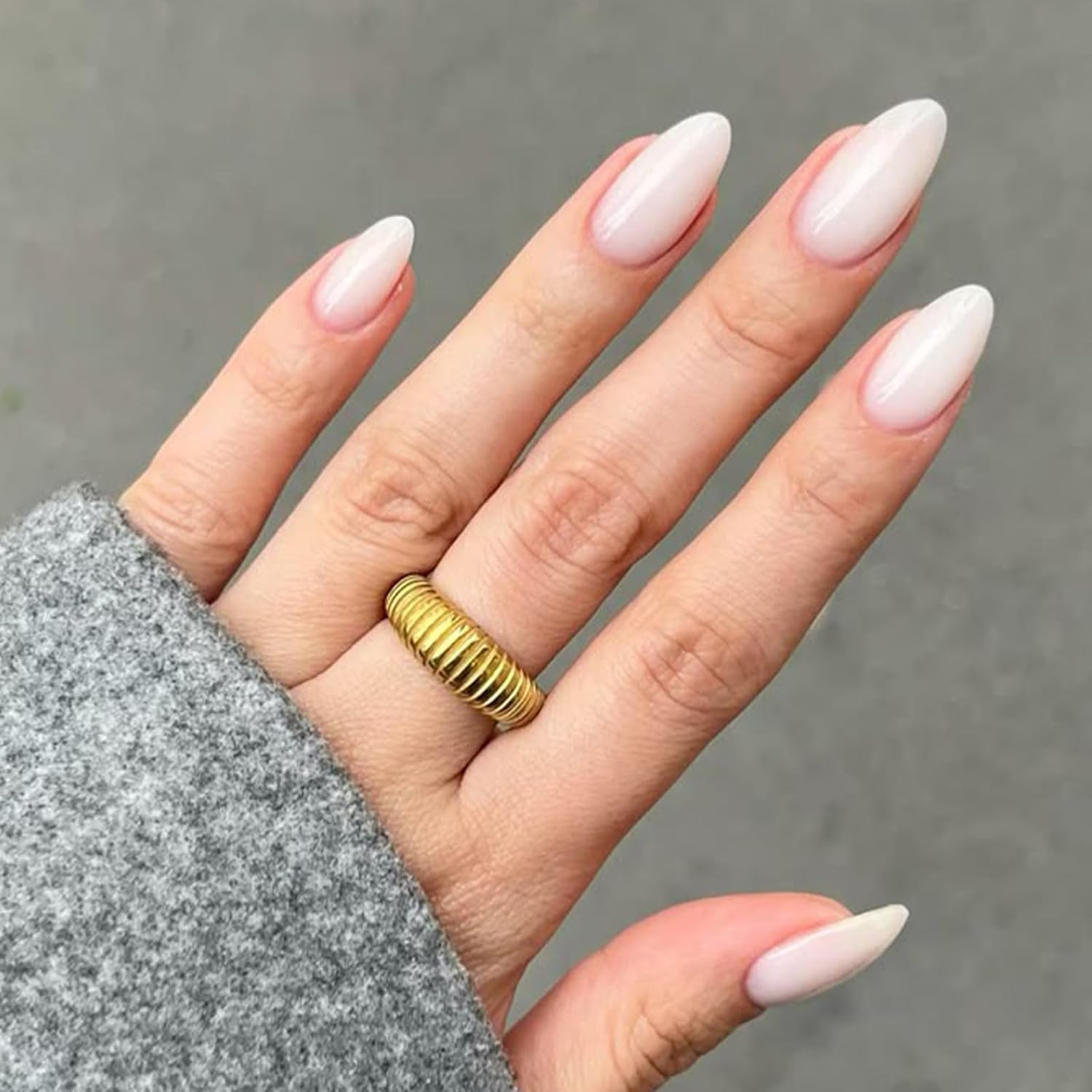 Modelones front packaging showing milky white almond nails and kit