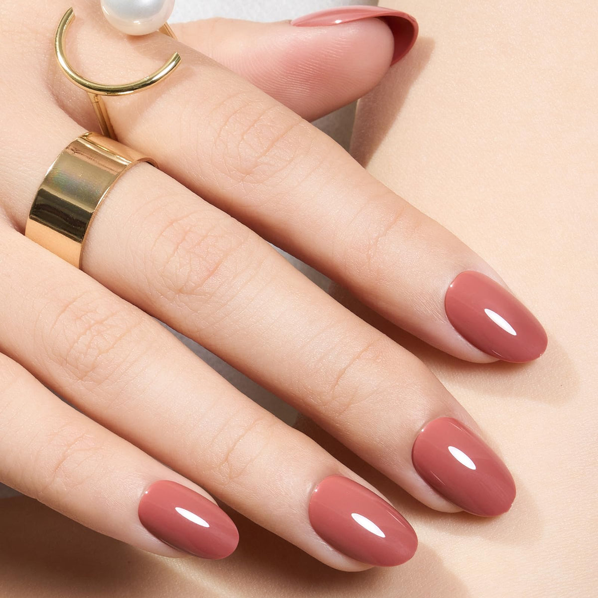 modelones front packaging showing pink oval press-on nails and included tools for ready manicures