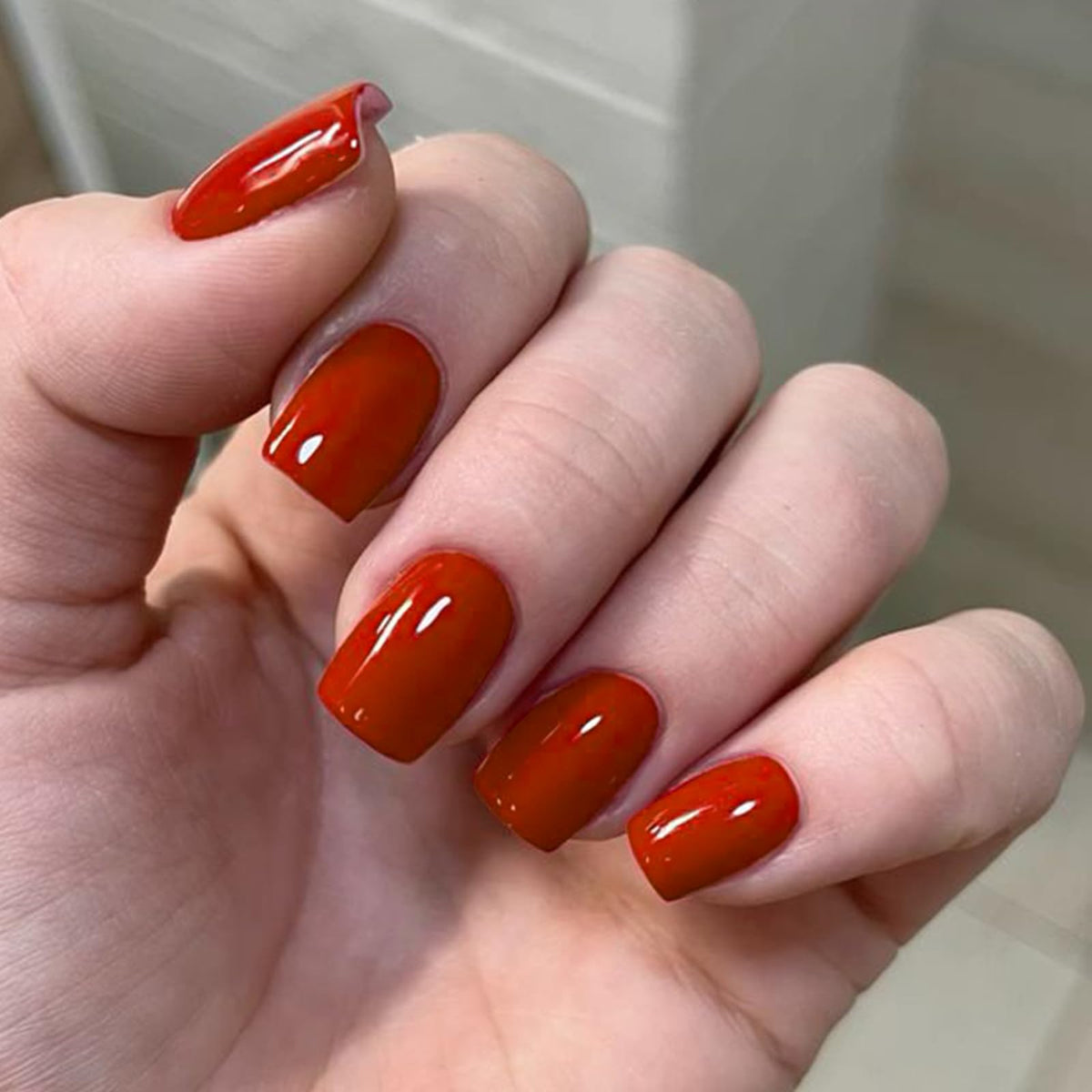modelones front packaging showing red press-on nails and kit benefits
