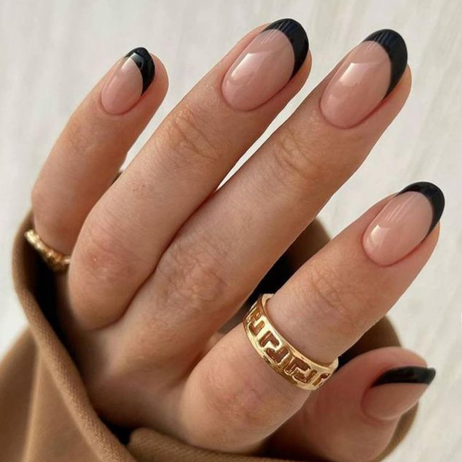 modelones worn on hand short oval shape offering a classic look