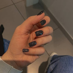modelones nails being pressed on hand for quick application