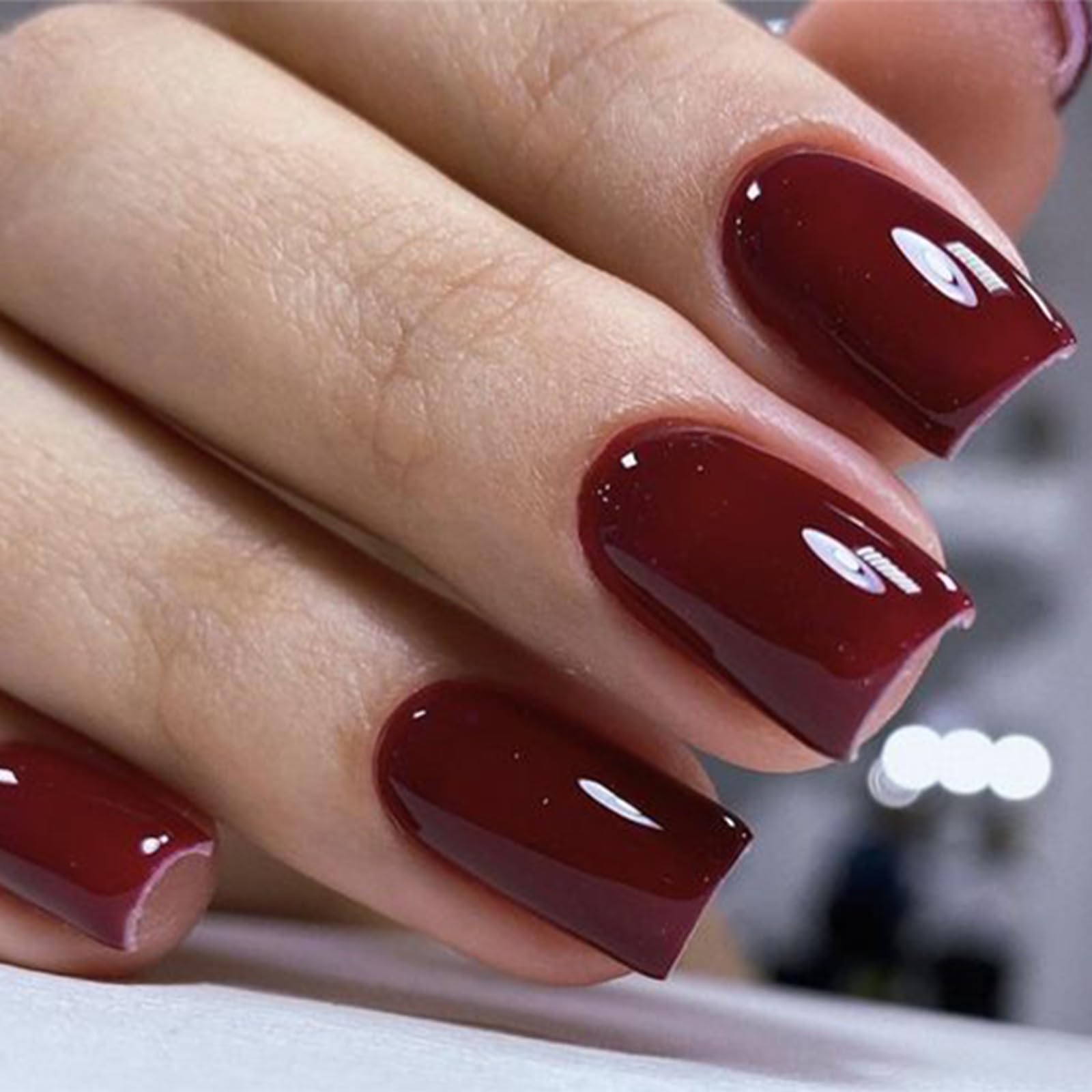 modelones short square nail close-up highlighting glossy finish and durability benefit