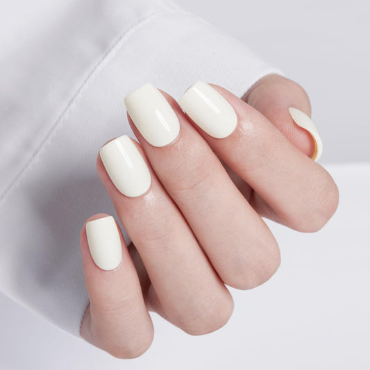 Modelones close-up of milky white short square nails highlighting smooth finish