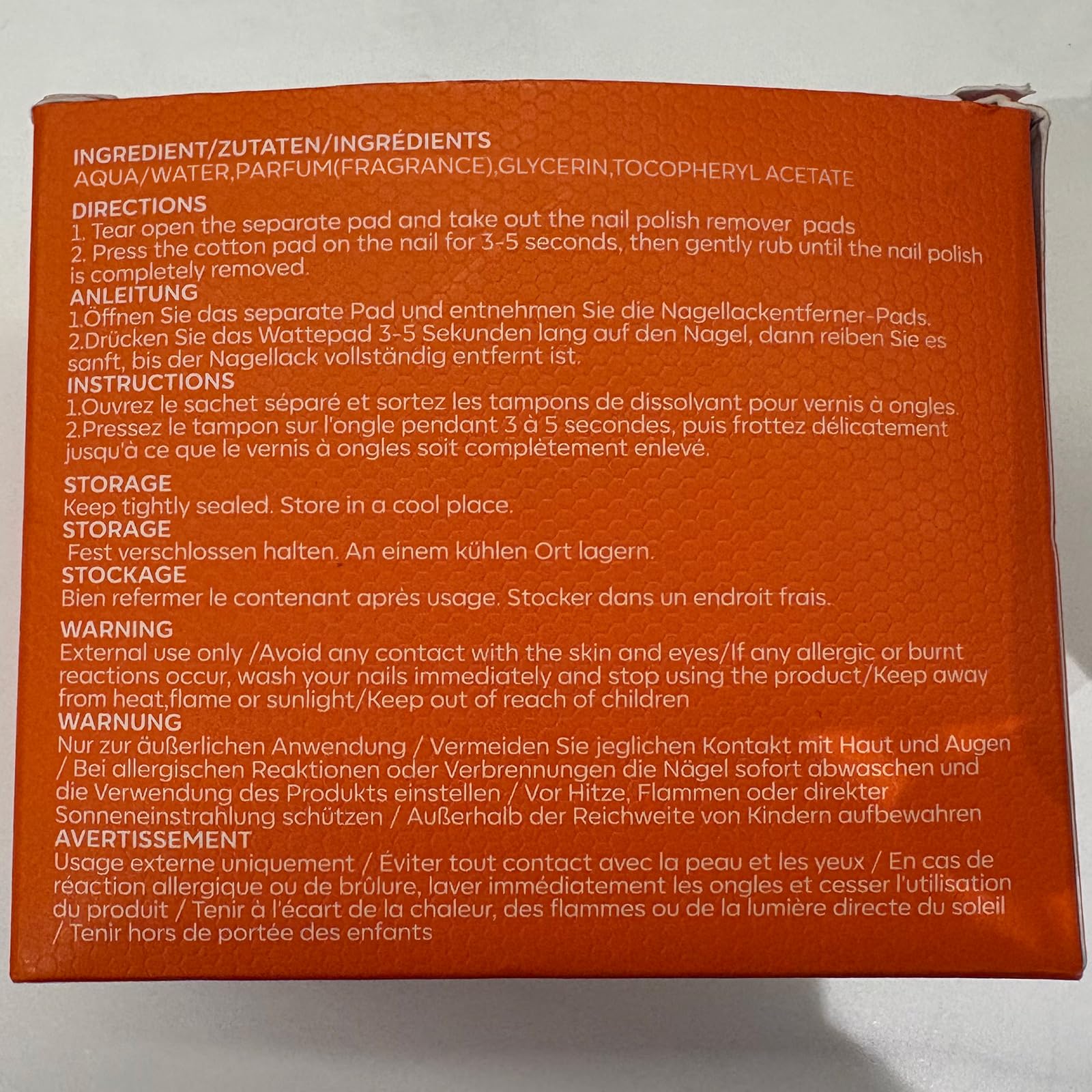 modelones wipe held next to a hand to show real size and coverage