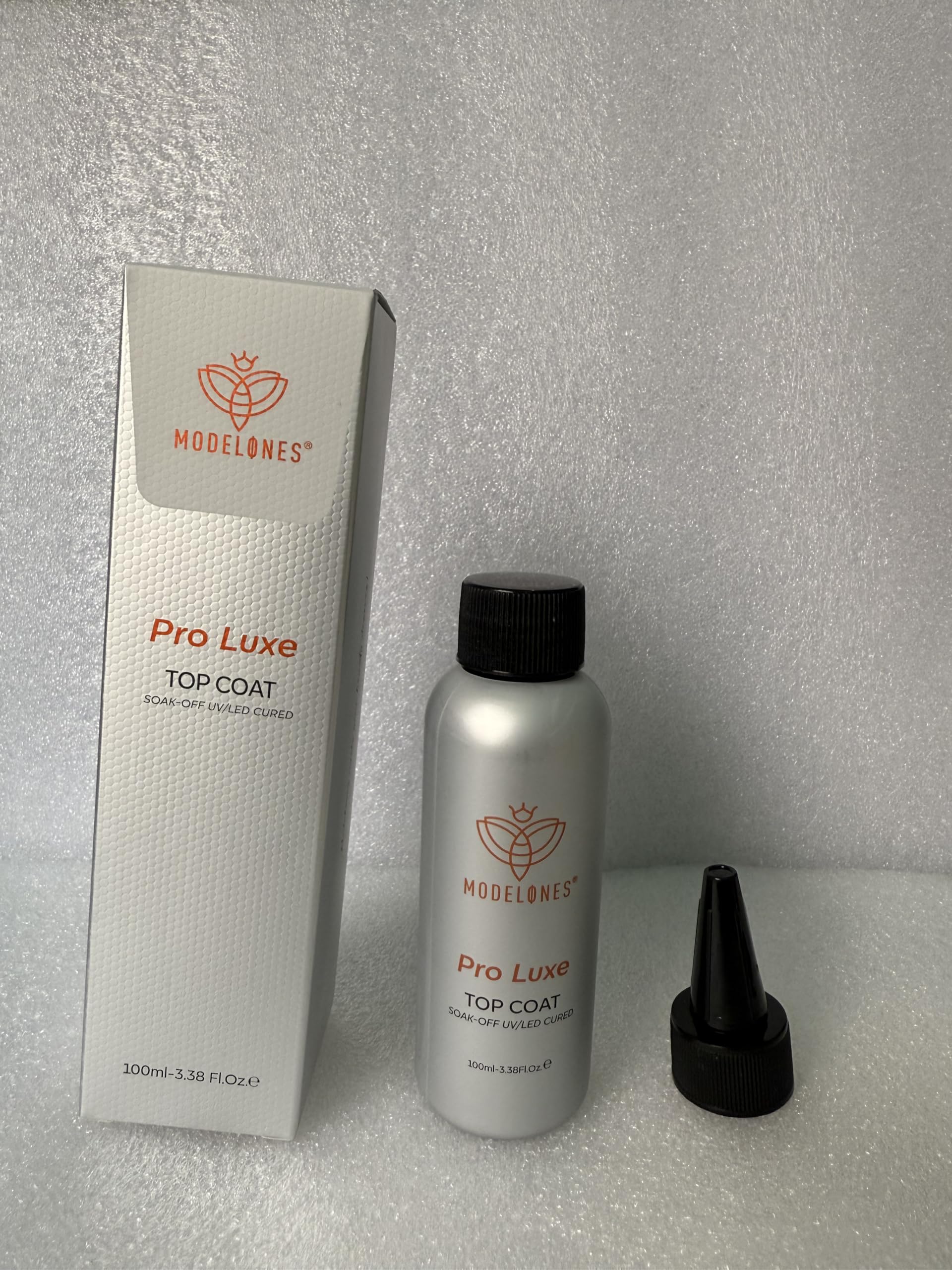 modelones bottle next to 15ml vial scale for refill value