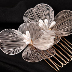 MOESUYUM side comb placed in an updo for secure hold and polished look