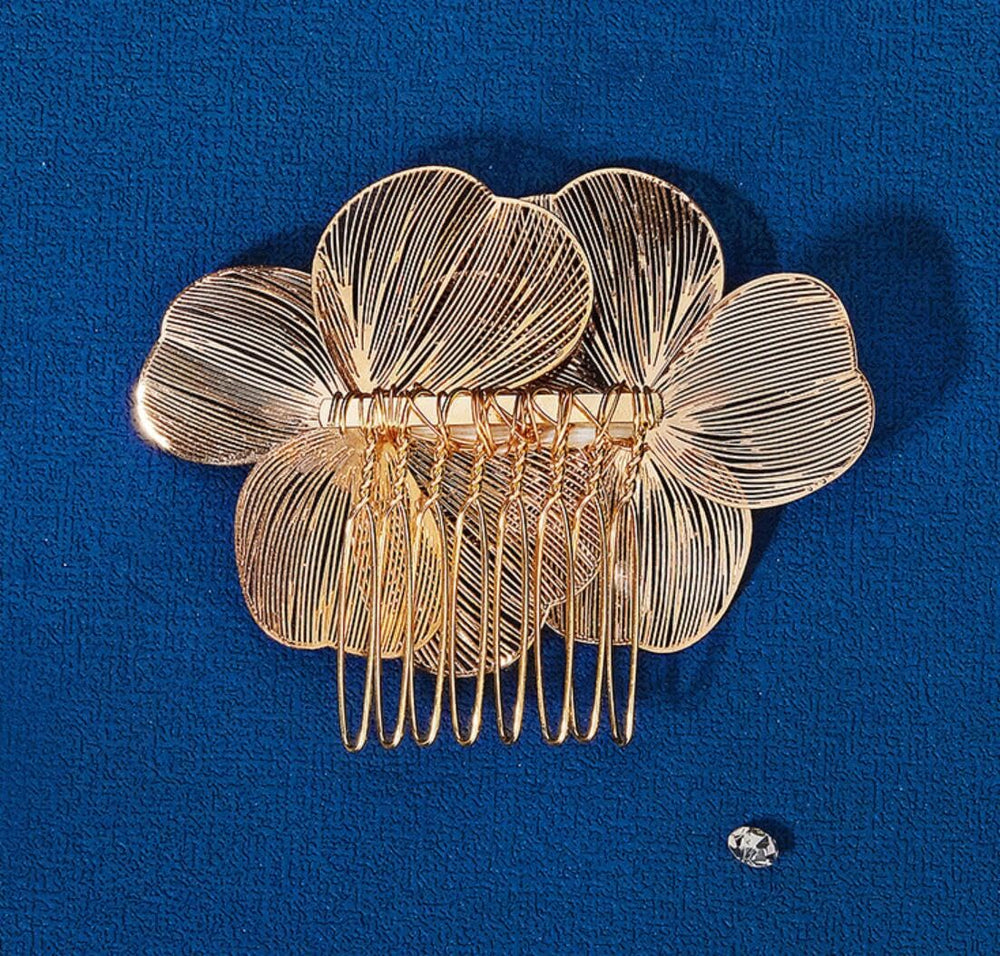 MOESUYUM comb next to hand showing compact scale and lightweight portability