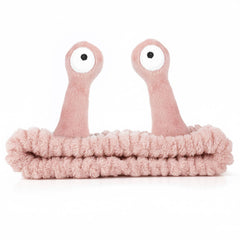Molain front view light pink headband showing cute Palm and Snail design and secure fit