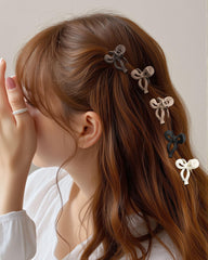 Molans clips held in hand to show compact 1.8-inch portable size