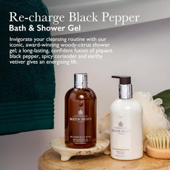 Molton Brown pump and label detail highlighting recycled bottle benefits