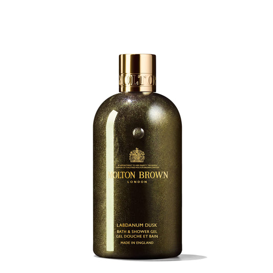 Molton Brown bottle front view showing label and luxurious amber hue, ideal for indulgent showers