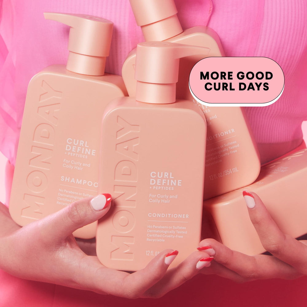 MONDAY HAIRCARE shampoo and conditioner pair staged in a shower for everyday use