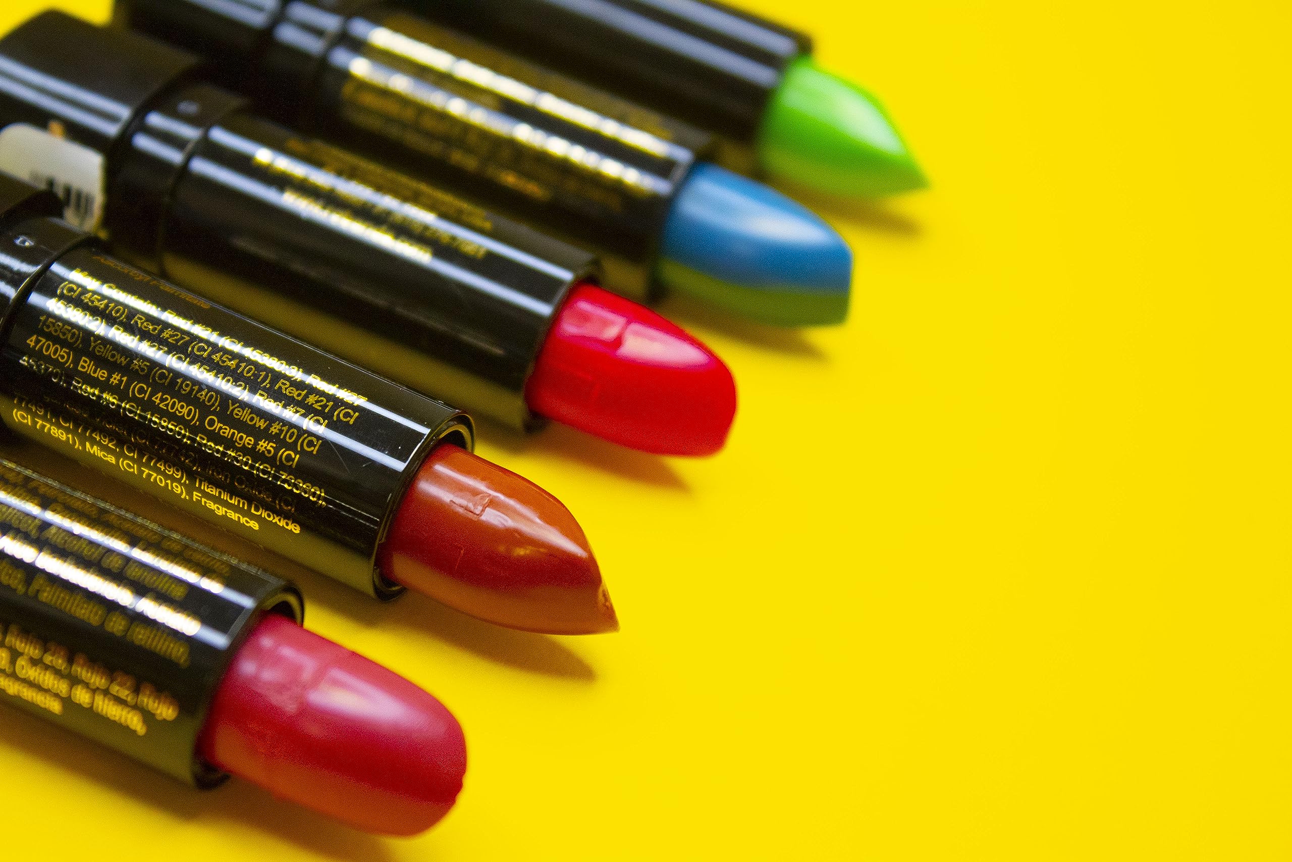 Mood Lips brown open tube with applicator demonstrating smooth glide and precise application