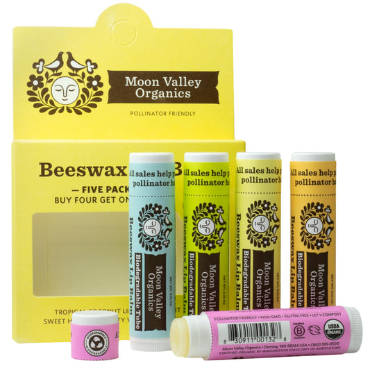 Moon Valley Organics front packaging showing five lip balm tubes and benefits