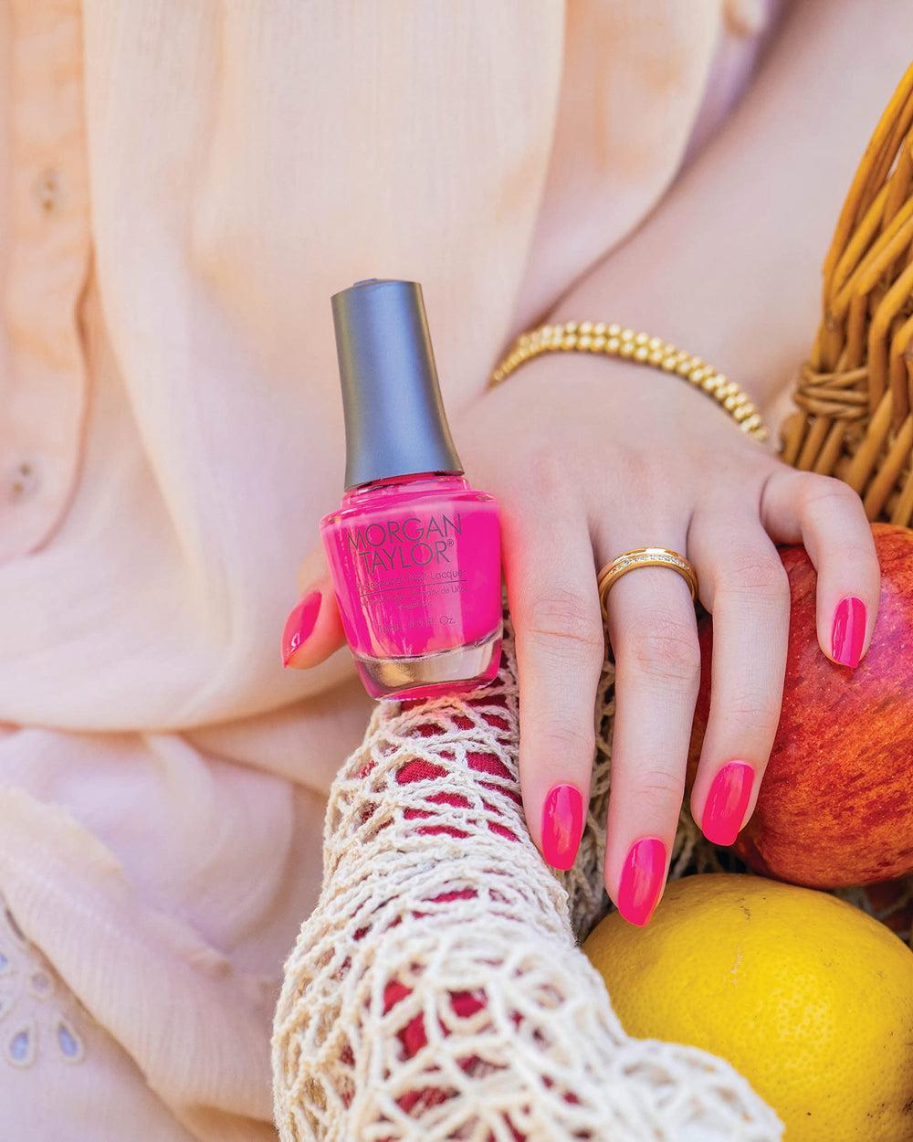 Morgan Taylor manicured hand in clutch showing high-shine finish for evenings