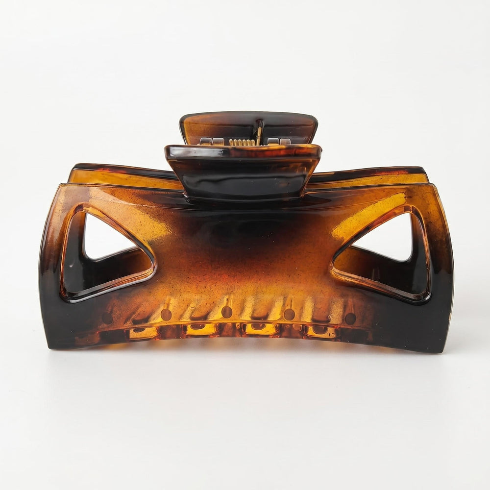 Morhom brown clip front view showing polished acetate and strong hold