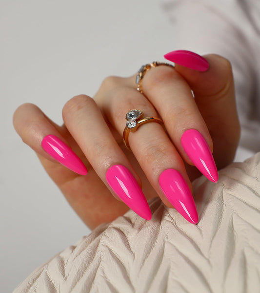 morily close-up of glossy hot pink surface highlighting shine and salon-quality appearance