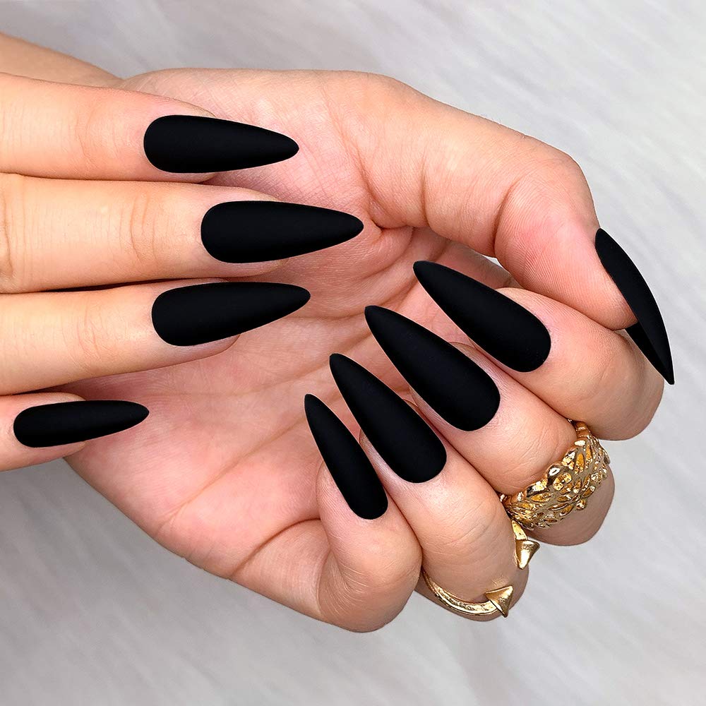 morily worn nails on hands demonstrating dramatic matte black style for events