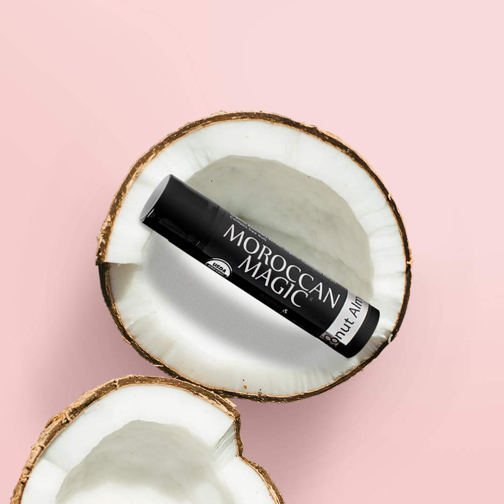 Moroccan Magic lip balm in a beach bag showing travel-friendly hydration