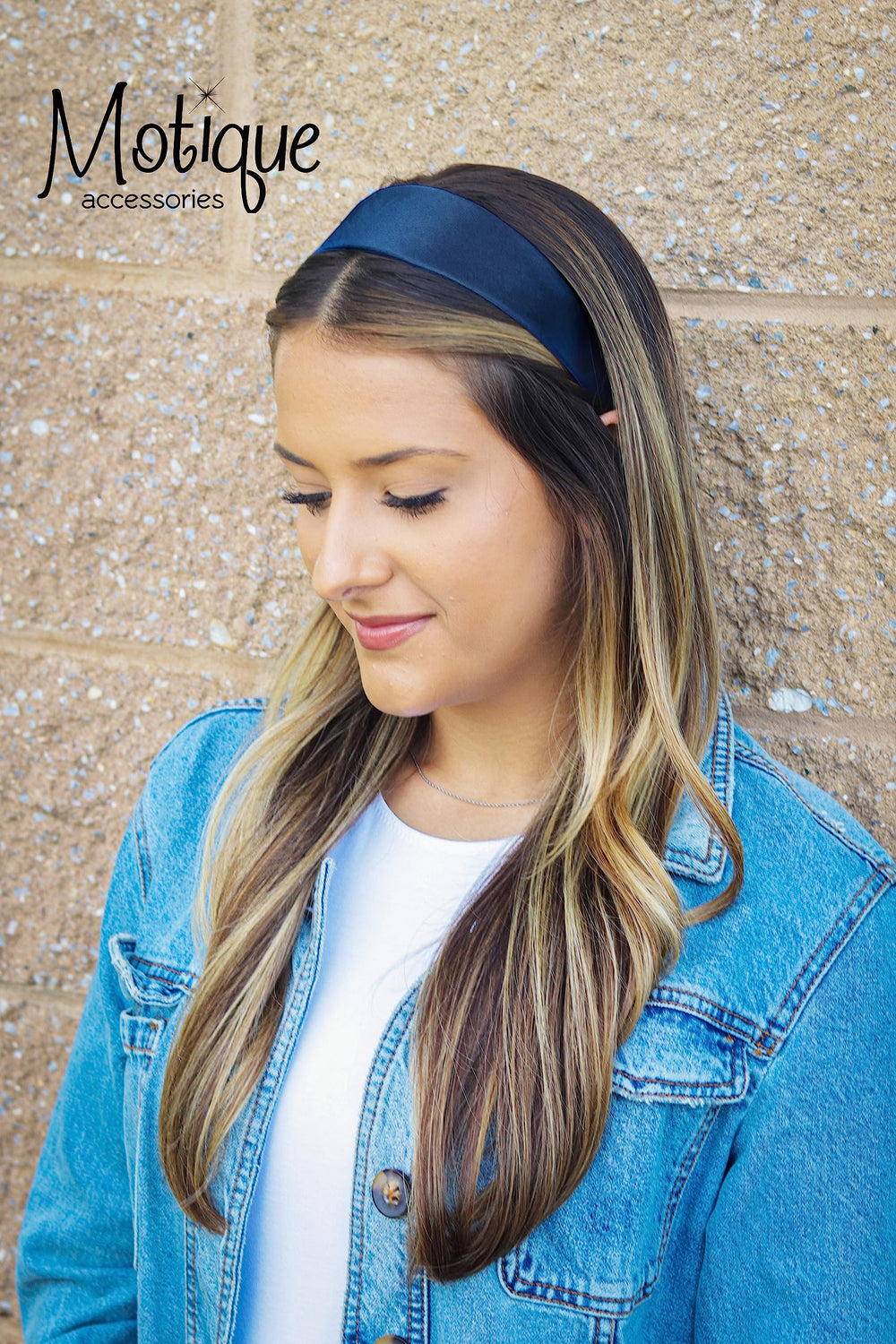 Motique Accessories navy headband worn by woman in ponytail demonstrating comfortable hold