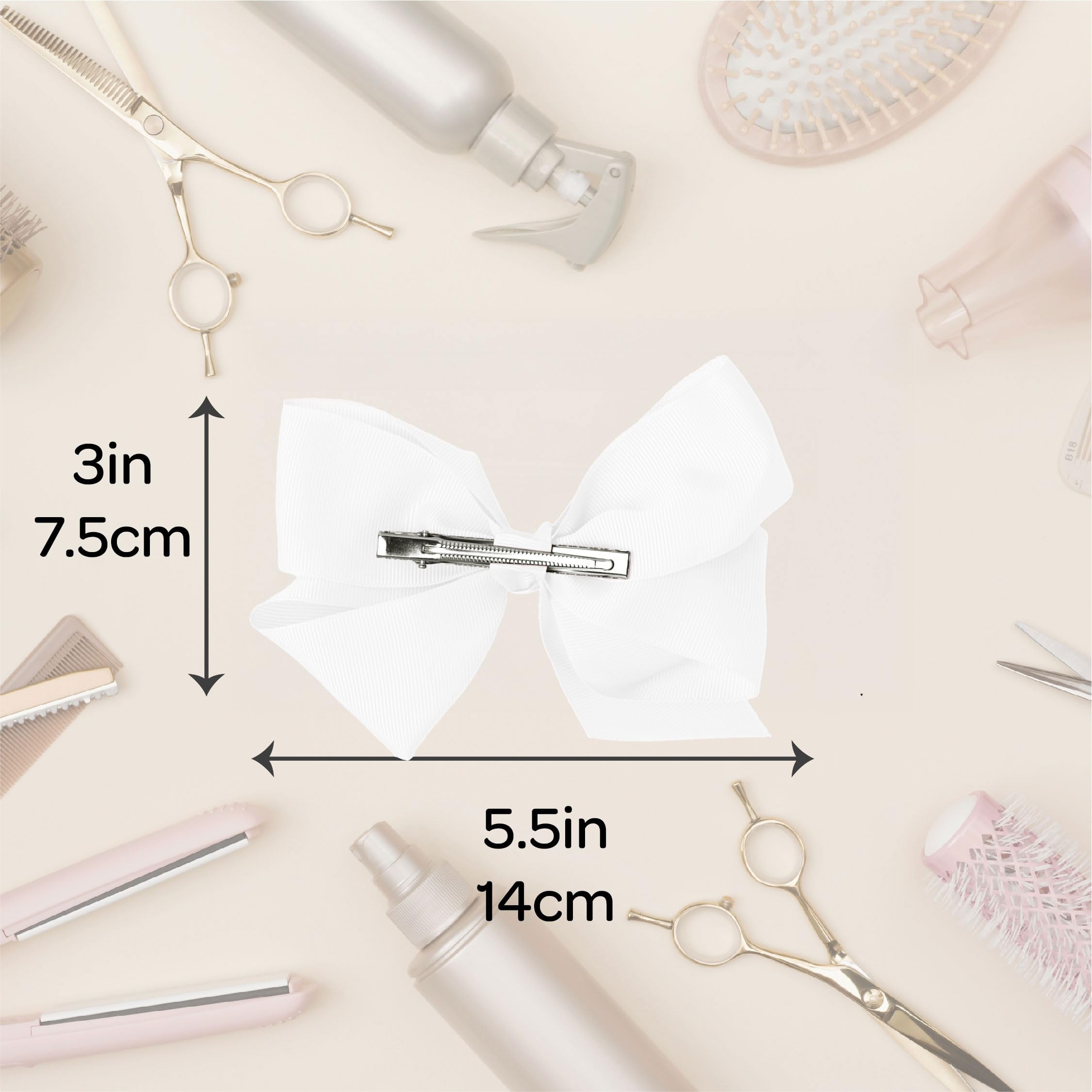 Motique Accessories bow next to hand to show true size and scale