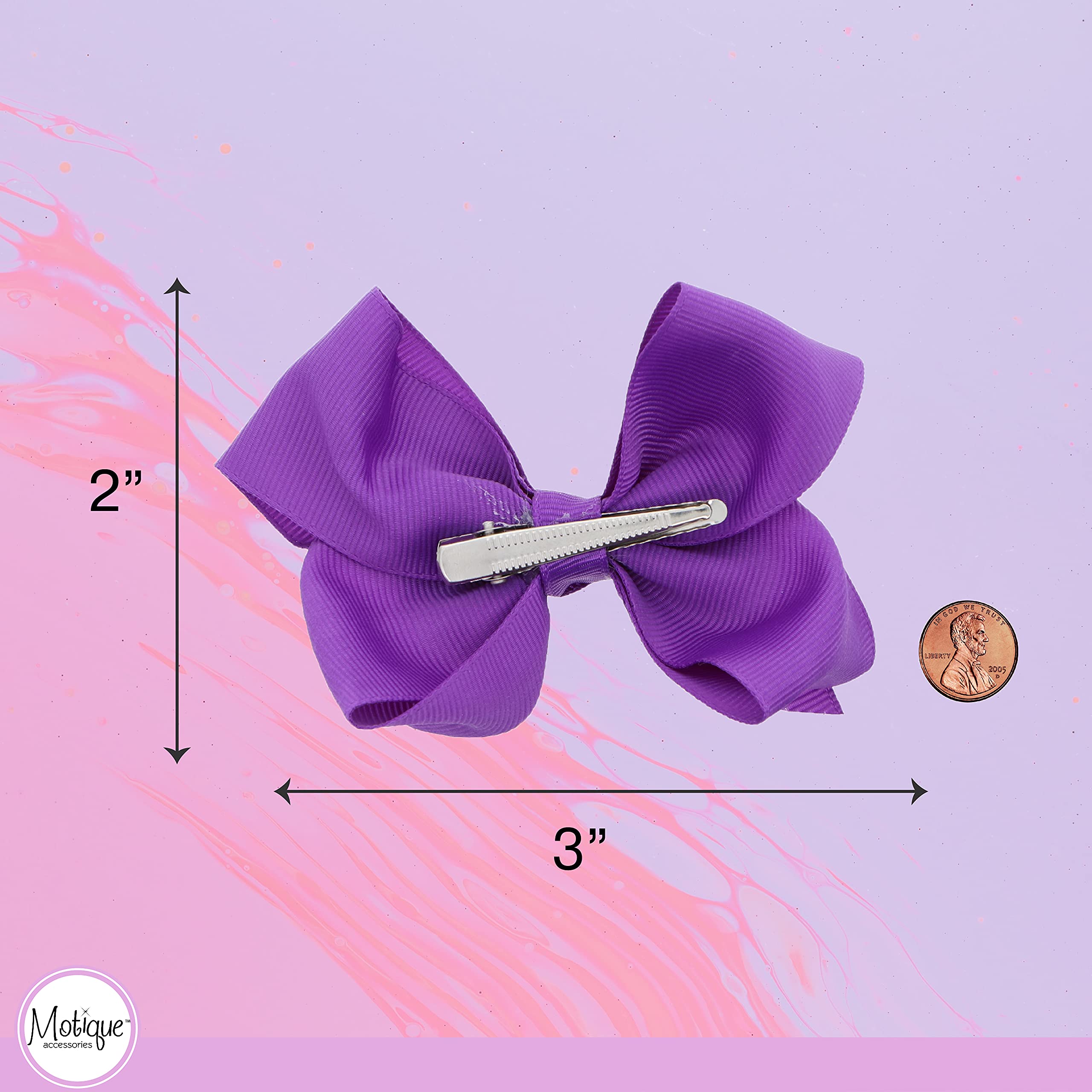 motique bows worn in child's hair for a coordinated outfit accent