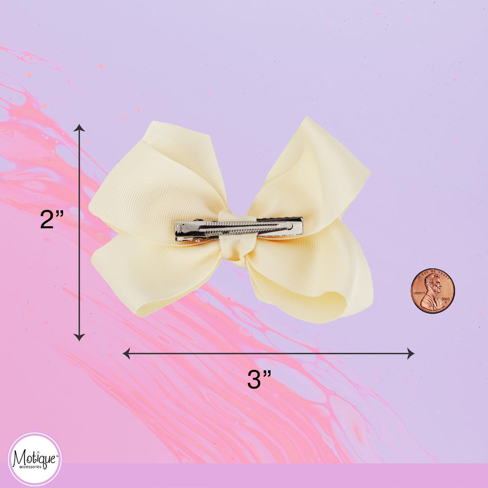 Motique Accessories bow worn in little girl's hair illustrating effortless style
