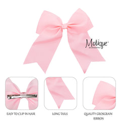 Motique Accessories bow clipped in hair lifestyle showing placement benefit: easy secure styling