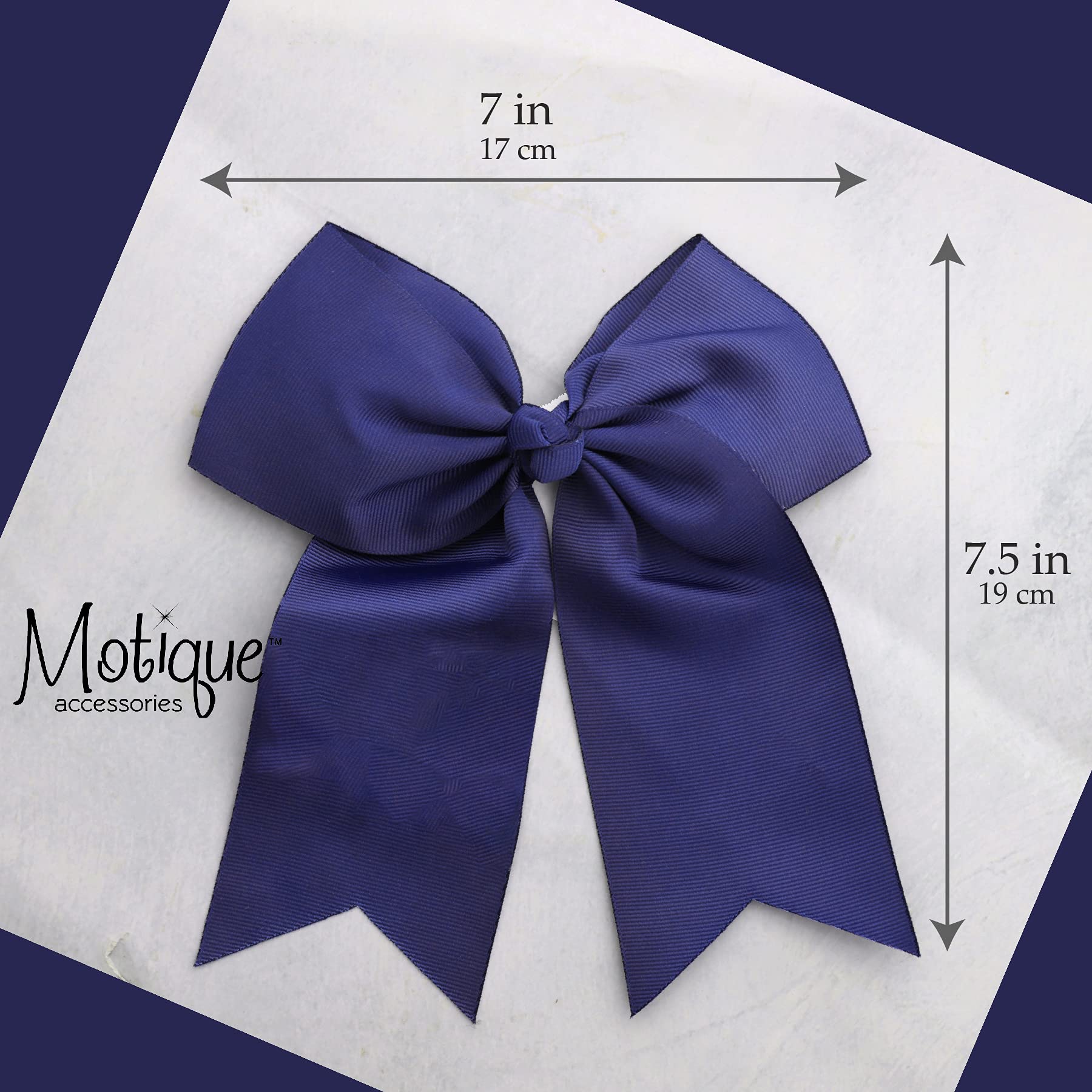 Motique Accessories bow beside ruler showing 7 inch width for scale