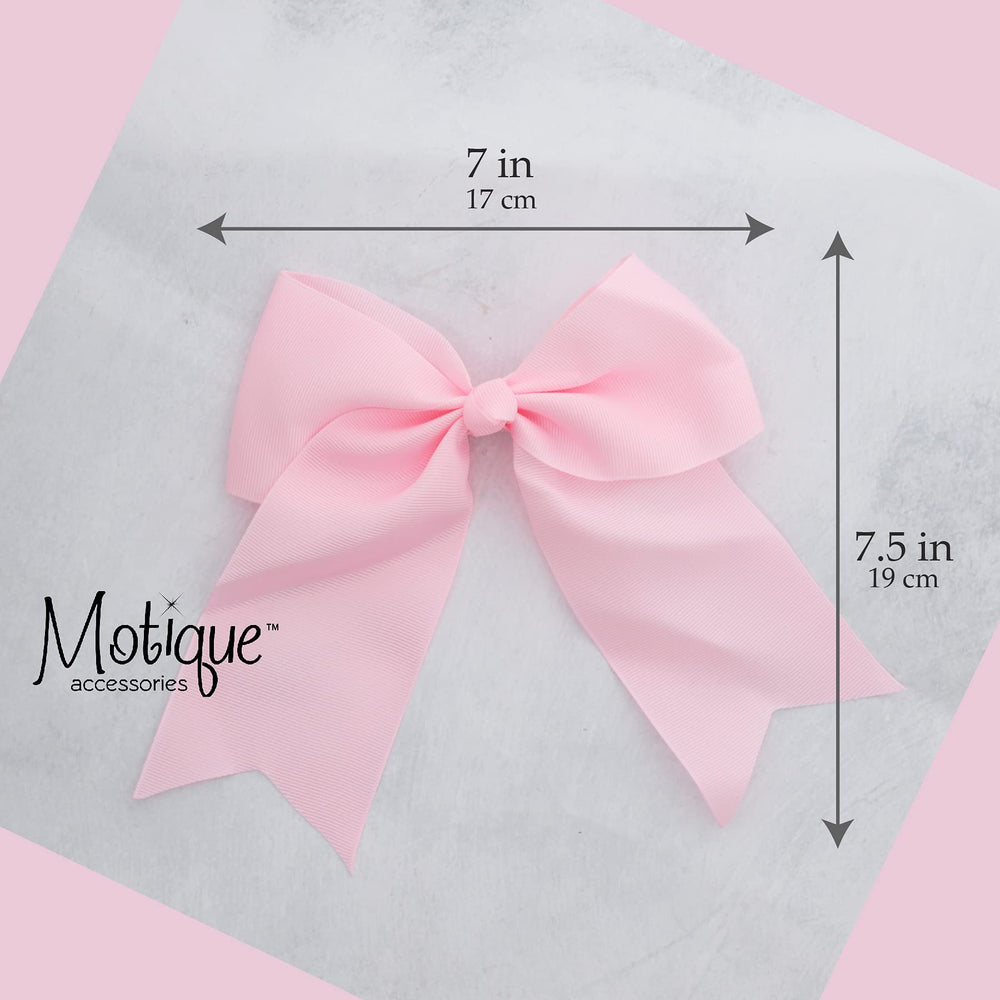 Motique Accessories bow beside ruler for size comparison benefit: clear scale of 7-inch width
