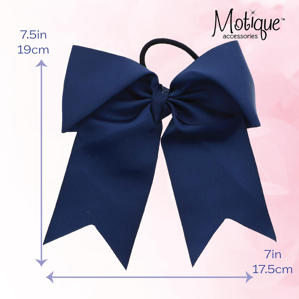 Motique Accessories bow beside ruler for size comparison and visible 7 inch width