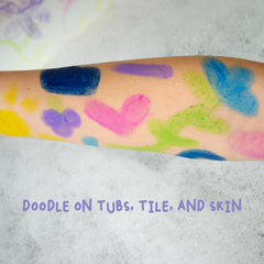 Hand next to a Mr. Bubble stick to show size and scale, kid-friendly design