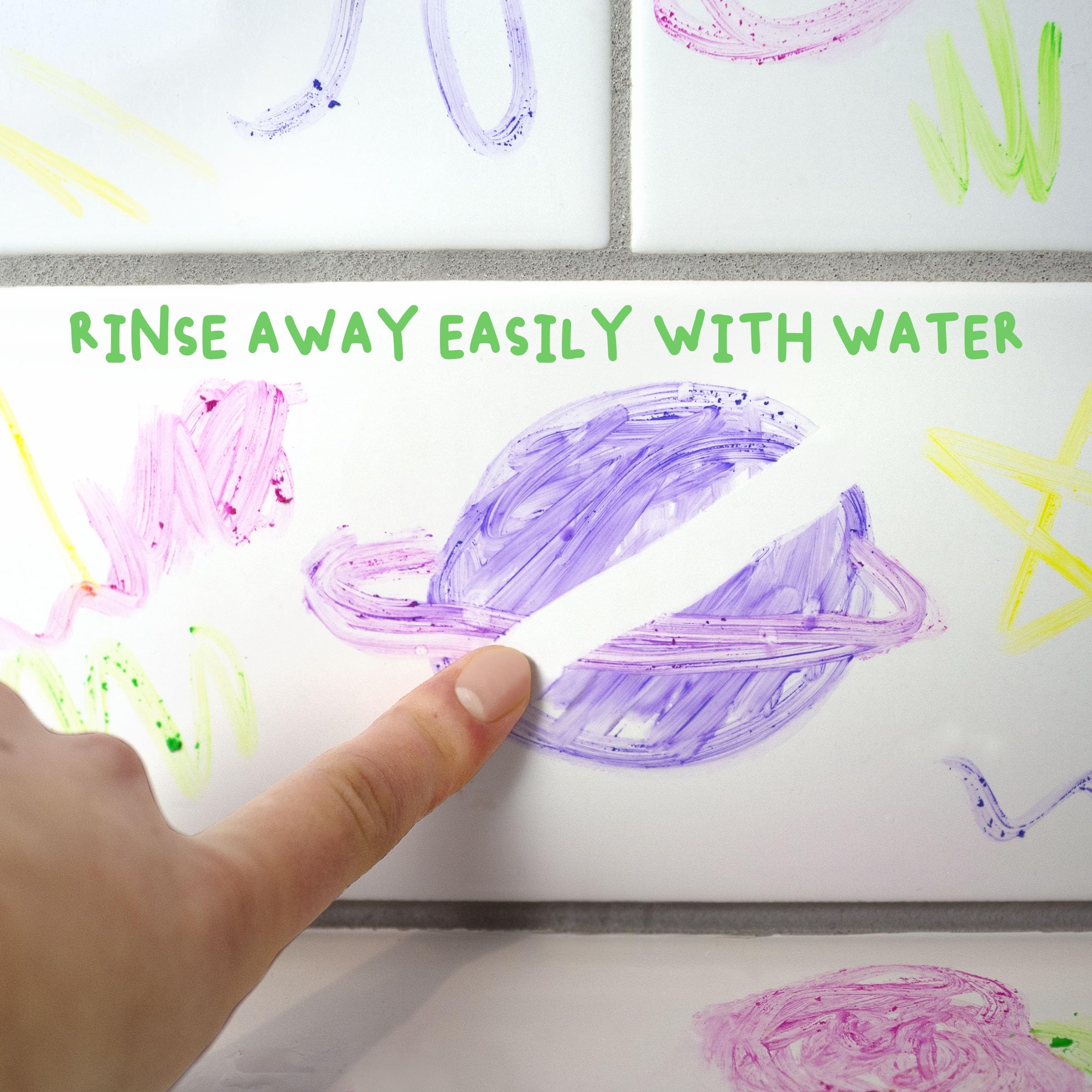 Rinsing paint from skin with water showing Mr. Bubble wash-off ease