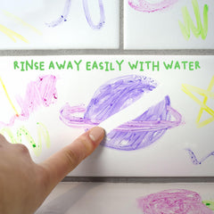 Rinsing paint from skin with water showing Mr. Bubble wash-off ease