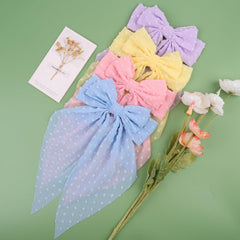 MRJ bow clip in a ponytail demonstrating elegant styling and comfortable wear