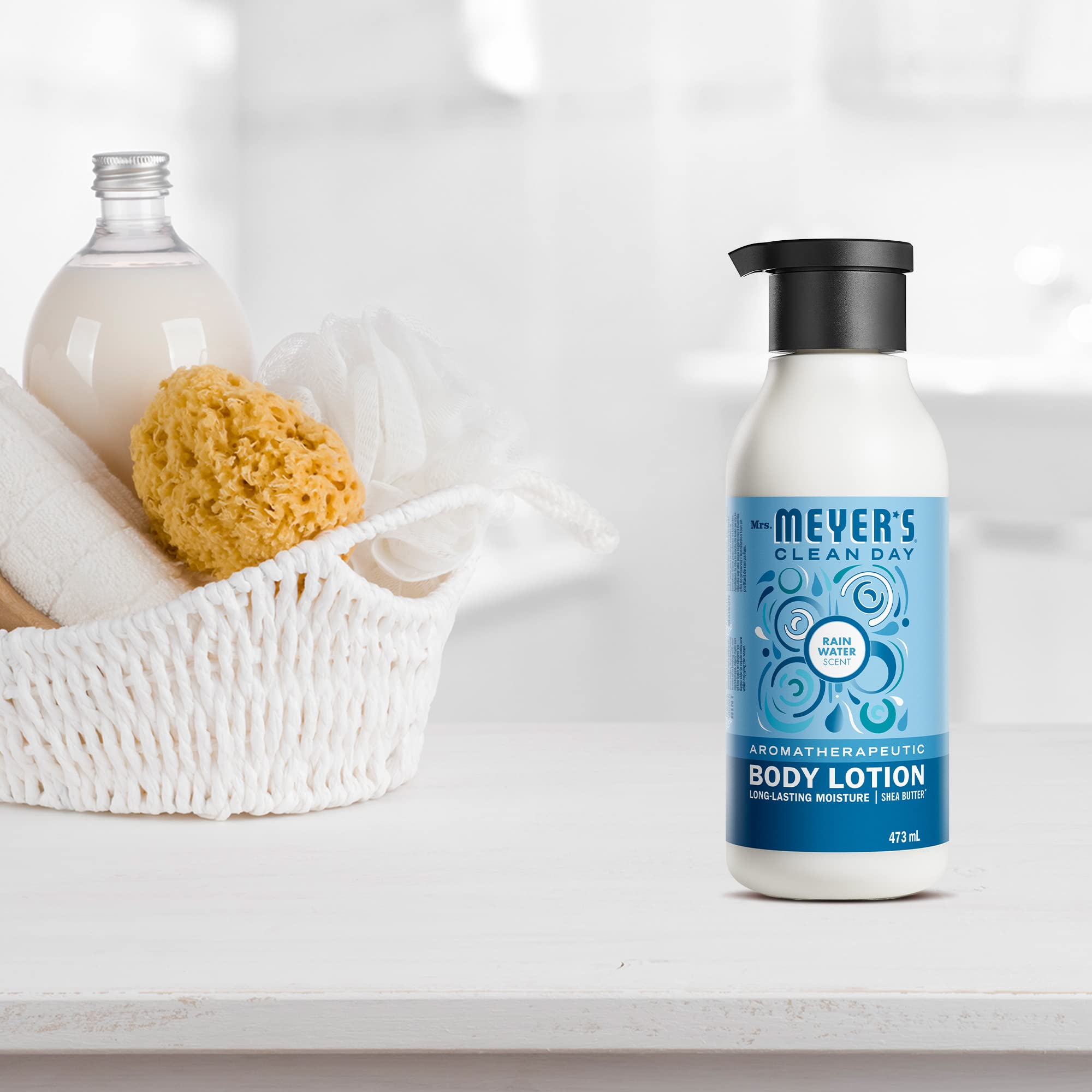Mrs. MEYER'S bottle on bath ledge in lifestyle setting suggesting post-shower freshness