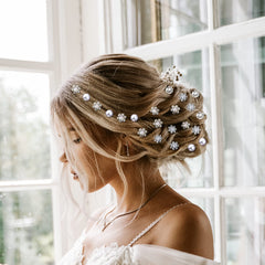 MTLEE pins styled on a bride in a wedding setting adding refined sparkle