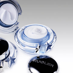 Mugler Angel cream applied on hand demonstrating smooth absorption and softness