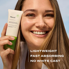Murad 1.7 fl oz tube next to hand conveying portable travel convenience