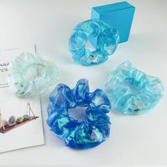 MUYANN arranged gradient blue scrunchies showing color coordination options