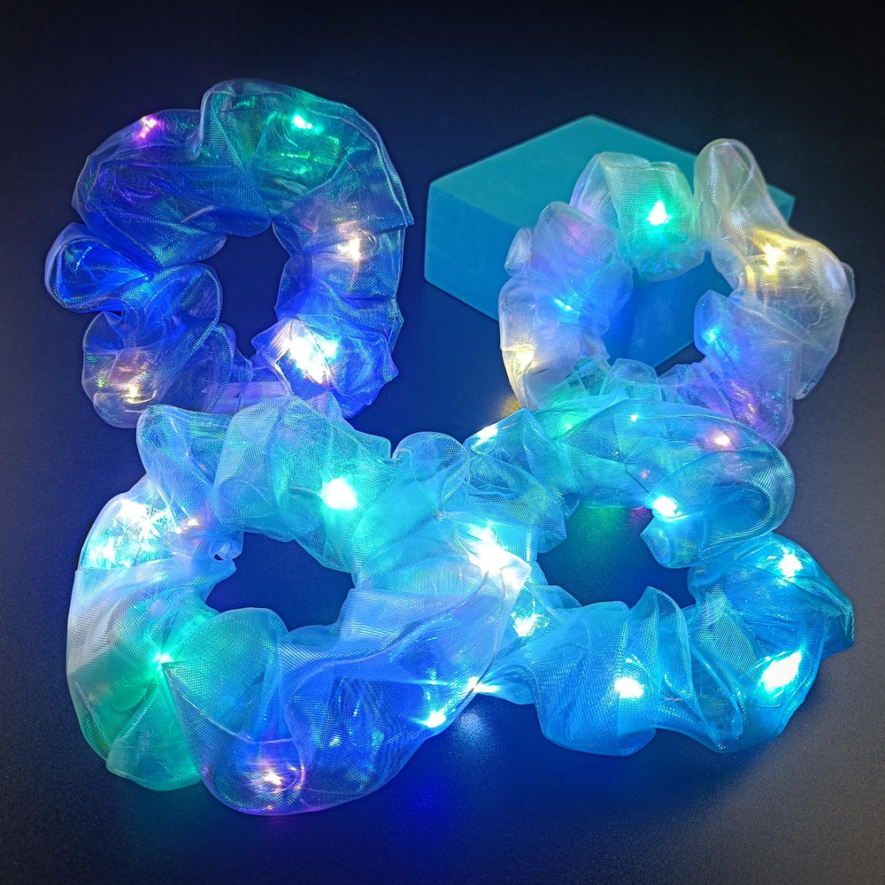 MUYANN scrunchie held in hand to show compact size and portability