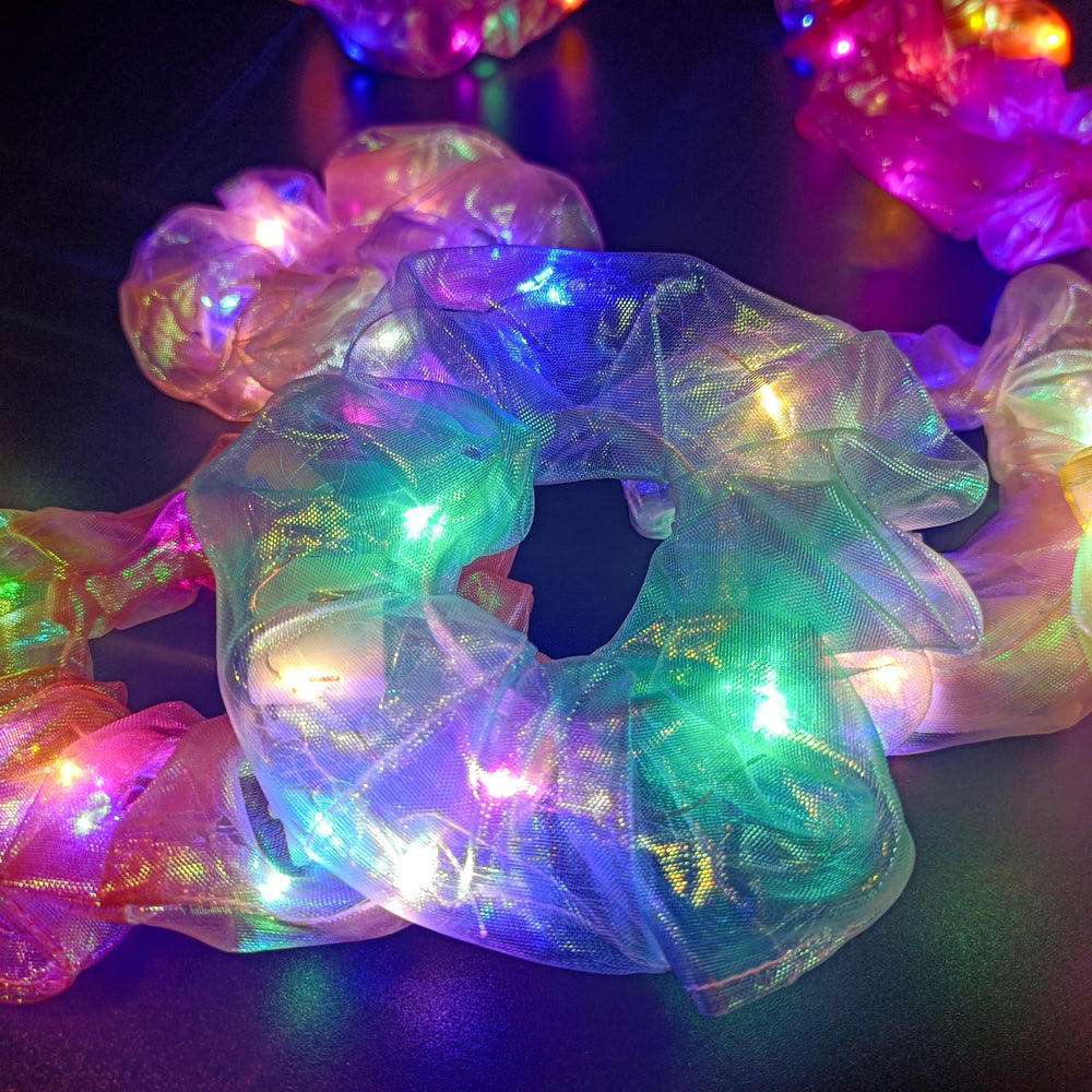MUYANN scrunchie worn on wrist as accessory adding playful illumination
