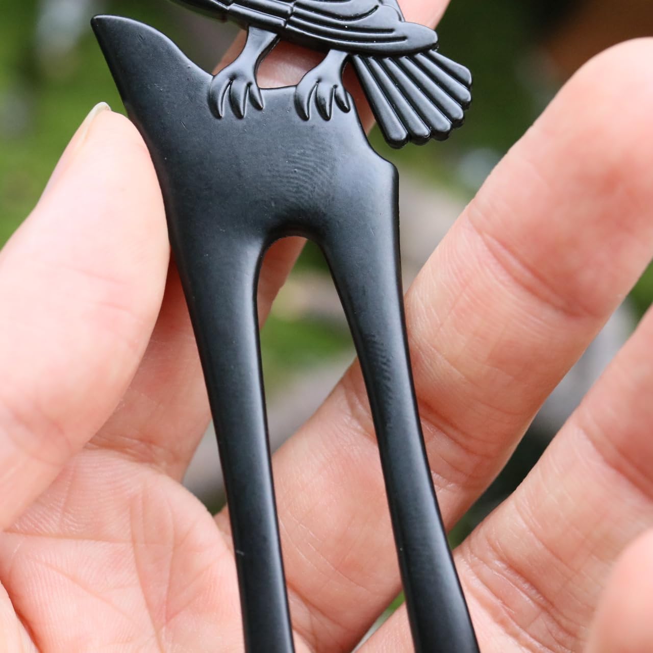 MYAROMA FINDINGS hair fork held in hand shows scale and substantial weight