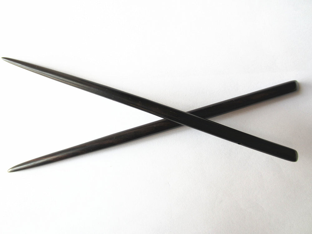 Myhsmooth front view of two hair sticks showing shape and length for secure hold